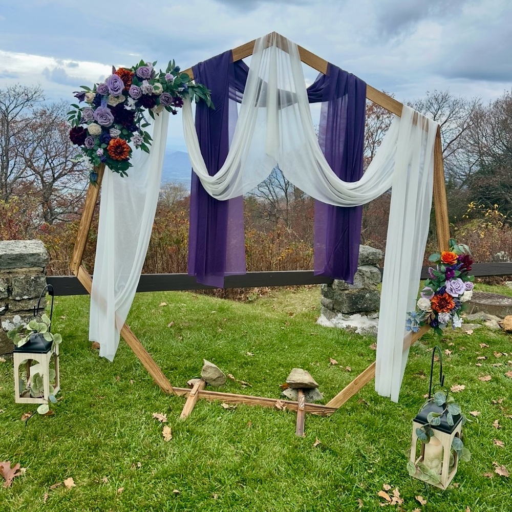 Lings Moment Chic Wooden Arch with Purple and White Drapes and flowers